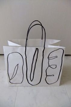 a white paper bag with black lines on it