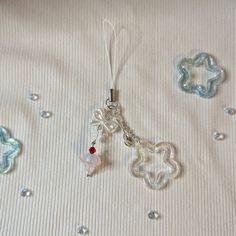 a white sheet with some charms on it