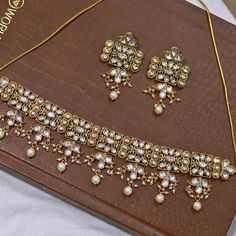 About: Enhance your style with our Designer Gold Plated Royal Kundan Necklace. This elegant set comes with matching earrings to complete your look. The intricate design and gold plating add a touch of royalty to any outfit. Perfect for weddings, parties, or any special occasion. Details: Eye-catching and unique jewelry that will set you apart. Gift this piece to a loved one, and see their face light up with joy. Best for gifting or for personal use, wear it to any occasion and become the spotlig Elegant Meenakari Metal Jewelry Sets, Elegant Gold Chandbali Kundan Necklace, Elegant Metal Kundan Necklace With Meenakari, Kundan Bridal Necklace With Matching Earrings In Temple Style, Festive Kundan Necklace With Matching Earrings For Formal Occasions, Elegant Festive Kundan Metal Necklace, Elegant Gold Sets For Festive Season, Formal Jewelry Sets With Matching Earrings, Elegant Gold Sets For Festive Occasions