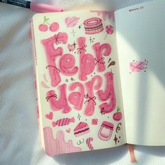 an open notebook with the words pop happy written in pink on it next to a pen