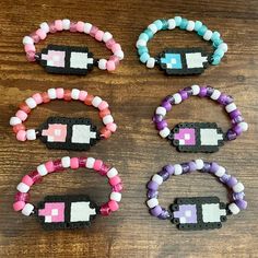 Message me for sizing concerns, one size should fit all! Handmade Pink Jewelry For School, Cute Black Friendship Bracelets, Cute Handmade Adjustable Wristband, Barbie Kandi, Adjustable Kawaii Bracelets For Friendship, White Adjustable Kawaii Beaded Bracelets, Kawaii Adjustable Beaded Bracelets As Gift, Handmade Novelty Purple Bracelets, Gloomy Bear Kandi Pattern