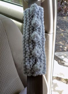 a crocheted headband sitting in the back seat of a car