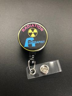 This unique retractable badge holder is adorable and useful. A great gift for any Radiation Therapist! These will be made with a belt clip back. If you prefer a swivel clip, let me know in the notes to seller section when checking out. Thank you!! :) Black Retractable Badge Holders As Gift, Black Retractable Badge Reel For Gift, Adjustable Black Retractable Badge Holder, Black Adjustable Retractable Badge Holders, Black Badge Reel With Swivel Clip As A Gift, Radiation Therapist Gifts, Radiation Therapist, Xray Tech, Retractable Badge Holder