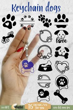 a hand holding a keychain with dogs on it and paw prints in the background