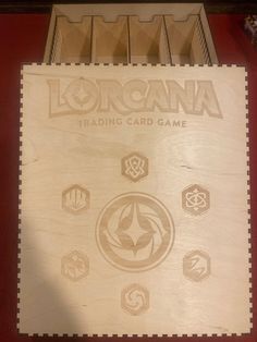 a wooden board with several different logos on it's sides and the words lorgana