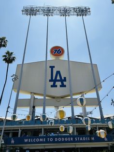 the dodgers stadium sign is decorated with balloons