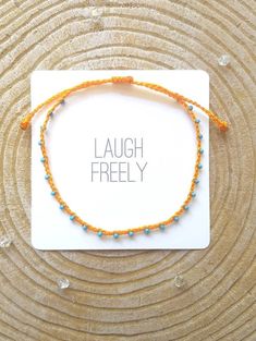 "♡Listing is for one dainty seed bead bracelet or anklet as featured and your choice of card♡ Perfect for everyday wear. Super dainty and minimalist look. Great way to add a little color to any outfit. Makes a very dainty stacking bracelet too. *Featured: Cord color-Tangerine Beads- Sky Blue Closure- A. With Beads *Material: Item is made with sturdy nylon cord. The cord resembles silk and color will not fade away. Tiny glass seed beads are carefully hand braided as the highlight of this item. *C Adjustable Beaded Chain Anklet As Gift, Tiny Beads Strand Anklet For Gift, Adjustable Orange Beaded Bracelets With Tiny Beads, Orange Tiny Beads Bracelet For Beach, Adjustable Dainty Anklets With Colorful Beads, Dainty Adjustable Anklets With Colorful Beads, Casual Blue Anklet With Tiny Beads, Double Sliding Knot, Adjustable Friendship Bracelet