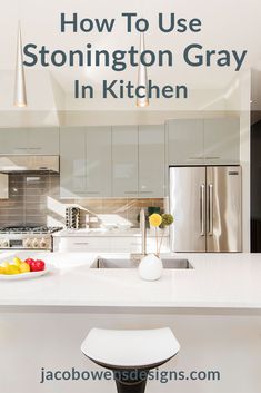 a kitchen with white counter tops and stainless steel appliances in the background is an advertisement for how to use stonington gray in kitchen