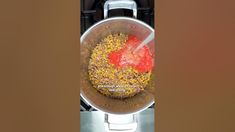 a frying pan filled with food on top of a stove