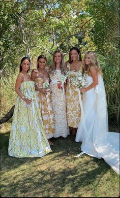 the bride and her bridesmaids pose for a photo