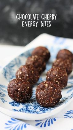 four chocolate balls on a blue and white plate