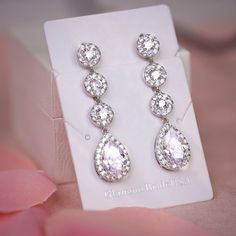 "Very romantic crystal bridal earrings. Gorgeous earrings for your special day! They measure about 1 1/4\" long and 1/4\" wide. High quality guaranteed by GlamourBrideUSA! SHIPPING: Standard Shipping: 4-6 business days Priority mail Shipping: 2-3 business days *INTERNATIONAL ORDERS: PLEASE NOTE CUSTOMERS ARE RESPONSIBLE FOR ALL DUTIES & TAXES*" Long Drop Silver Crystal Earrings For Weddings, Crystal Chandelier Earrings For Wedding, Wedding Long Drop Linear Earrings In Cubic Zirconia, Glamorous Long Drop Crystal Earrings For Wedding, Crystal Linear Earrings For Wedding, Glamorous Long Drop Bridal Earrings For Wedding, Crystal Dangle Bridal Earrings For Anniversary, Long Drop Crystal Earrings For Wedding, Crystal Dangle Earrings For Wedding