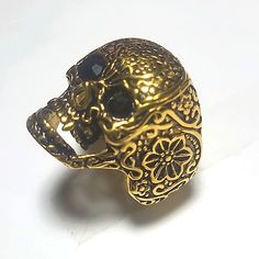 Brand New Beautiful Detailing- Flowers And Swirls Engraved And Oxidized Black Crystal Bead Eyes Gold Plate Over Stainless Steel Size 10 Weighs 20.67 Grams Very Unique Unisex Skeleton Head Candy Skull Luxury Gold Skull Ring As A Gift, Luxury Gold Skull Ring For Gift, Luxury Black Skull Rings, Unique Luxury Gold Skull Ring, Gold Skull Ring Collectible, Candy Skull, Skeleton Head, Candy Skulls, Skull Ring