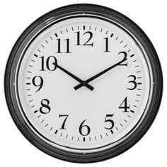 a black and white clock with numbers on the face is shown against a white background