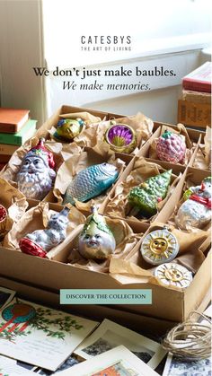 a box filled with lots of different colored ornaments