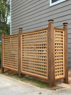 a wooden fence is next to a house