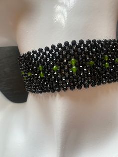 Black onyx choker with peridot accents, beaded using the traditional Masai method, but using real gemstones. Choker Black, Gemstone Choker, Black Onyx Necklace, Onyx Necklace, Onyx Gemstone, Necklace Crystal, Choker Necklaces, Beaded Choker, Crystals And Gemstones