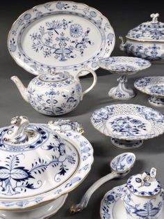 an assortment of blue and white porcelain items