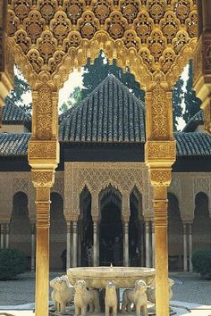 an intricately designed fountain in the middle of a courtyard with arches and pillars,