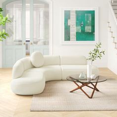 a living room filled with furniture and a staircase