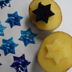 two yellow cupcakes with blue stars on them