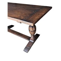 an old style wooden table with two legs