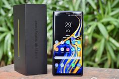 the samsung galaxy note 9 is next to its box