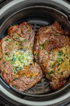 two steaks are in the slow cooker