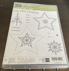 a clear plastic cutting board with snowflakes and stars on the front, it's the season