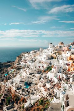 white buildings on the cliff overlooking the ocean