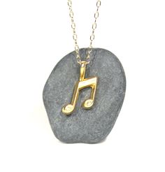 Gold music note necklace - music note - eighth note necklace - a 14k gold plated eighth note on a 14k gold filled chain This perfectly cute and tiny 14k gold plated sterling silver eighth note hangs happily from a 14k gold filled chain in the length of your choice! Please feel free to select a different length chain if you prefer! This beauty is also available in sterling silver. The music note measures 12mm x9mm. Looking for other charm necklaces? https://www.etsy.com/shop/BubuRuby?section_id=1 Personalized Gold Music-themed Jewelry, Necklace Music, Music Note Necklace, Eighth Note, Charm Necklaces, Music Note, Gold Filled Chain, Music Notes, Gold Plated Sterling Silver