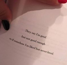 a woman's hand holding an open book with the words they say i'm good