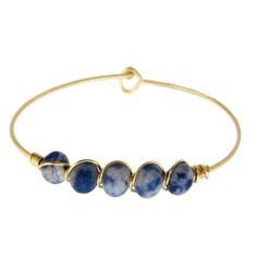 Blue Sodalite Beaded Gold Bangle Bracelet, Natural Gemstone Bracelet, Dainty Wire Stacking Boho Bracelet, Stackable Healing Bracelet For Women Accessorize with a beautiful unique sodalite natural stone wire gold bangle bracelet with hook closure. Add this blue beaded bracelet to your fashion jewelry collection, or send it as a great gift for someone special. Enjoy stacking your natural gemstone bracelet with other bangles from my collection for the ultimate layered look. Actual color may vary sl Adjustable Hand-strung Lapis Lazuli Bracelets, Adjustable Wire Wrapped Crystal Bracelet With Round Beads, Adjustable Lapis Lazuli Bracelet With Round Beads, Adjustable Stackable Round Beads Bangle, Adjustable Stackable Bangle With Round Beads, Stackable Adjustable Bangle With Round Beads, Adjustable Blue Wire Wrapped Bracelets, Adjustable Wire Wrapped Crystal Bangle Bracelet, Adjustable Natural Stone Beaded Bangle Bracelet