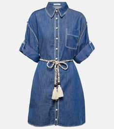 Denim shirt dress in blue - Zimmermann | Mytheresa Elegant Buttoned Cotton Denim Dress, Elegant Cotton Denim Dress With Buttons, Elegant Buttoned Denim Dress, Cotton Shirt Dress With Pockets For The Beach, Belted Cotton Shirt Dress For Spring, Summer Cotton Shirt Dress With Belted Cuffs, Casual Belted Shirt Dress For The Beach, Cotton Shirt Dress With Belted Cuffs, Spring Cotton Belted Shirt Dress