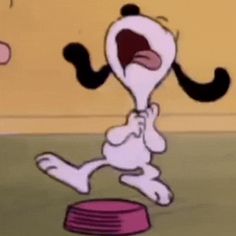 a cartoon character with his mouth open and tongue out, standing in front of a bowl