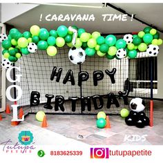 a soccer goal decorated with balloons and balls for a birthday party at the school or office