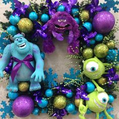 the wreath is decorated with purple, blue and green decorations