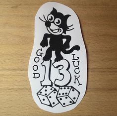 a sticker with a cat on it that says do you try? 13 dice