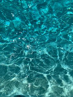 the water is very clear and blue with little ripples on it's surface