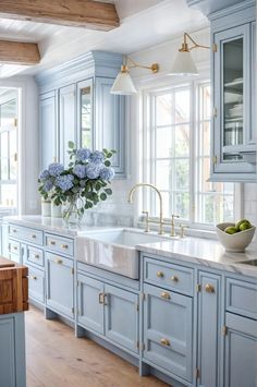 a kitchen with blue cabinets and white counter tops