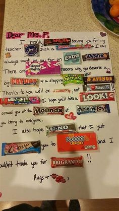 a handwritten note with candy bars on it