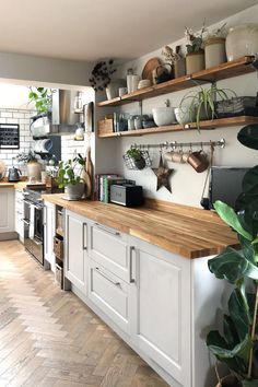 a kitchen filled with lots of wooden counter tops