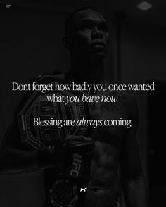 a man holding a boxing glove in his hand with the quote don't forget how badly you once wanted what you have now