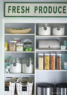 an organized pantry with fresh produce and storage bins on the bottom shelf, labeled fresh produce