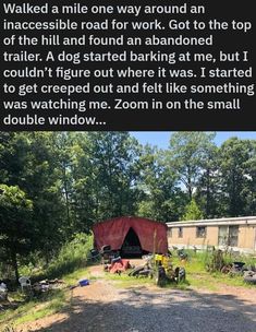 an rv park with a red tarp on the ground and trees in the background