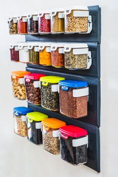 the wall mounted spice rack is filled with spices