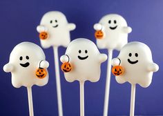 halloween marshmallows with ghost faces and jack - o'- lanterns on them