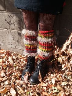 "Stay warm, cozy and stylish with these fun and unique Leg/arm warmers. They have an elastic enforced top to keep them firmly in place. The mixing of yarns, colors and textures are a feast for the eyes and exciting to touch! Wear to dance, for cosplay or pair with your favorite outfits.  Size: One size fits most Measurements: about knee high 17\". Width- about 10-11\" but stretch quite a bit.  Each piece is hand knitted and one of a kind. Care instructions : hand wash in cold water.  Hang dry  or dry flat.  Please let me know if you have any additional questions." Casual Winter Festival Leg Warmers, Winter Festival Leg Warmers, Multicolor Knitted Leg Warmers For Fall, Cozy Multicolor Knitted Leg Warmers, Cozy Knitted Multicolor Leg Warmers, Handmade One Size Leg Warmers For Winter, Hand Knitted Cozy Leg Warmers, Leg Arm Warmers, Hippie Festival