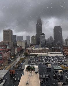 the city skyline is covered in heavy rain