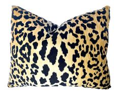 a leopard print pillow on a white background